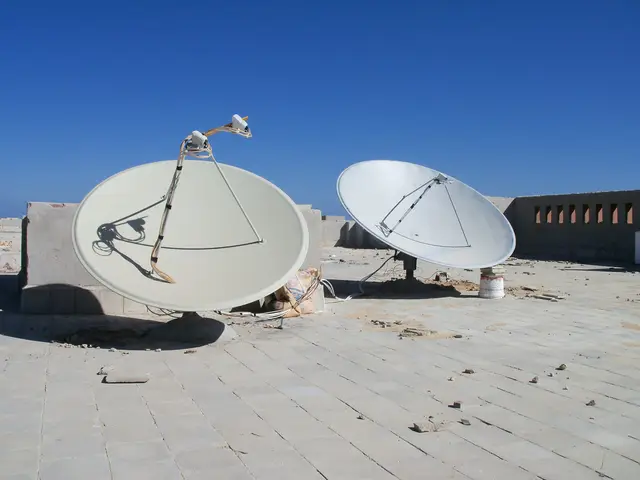 Two satellite dishes on the roof