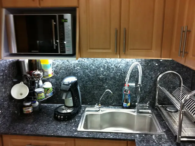 Built-in kitchen with sink and microwave