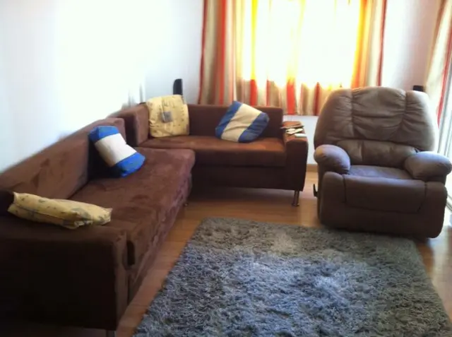 Living room with sofa and armchair